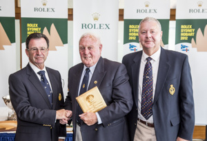 Rowan Johnson receives his Meritorious Service Award from CYCA Commodore Howard Piggott and RYCT Commodore Graham Taplin